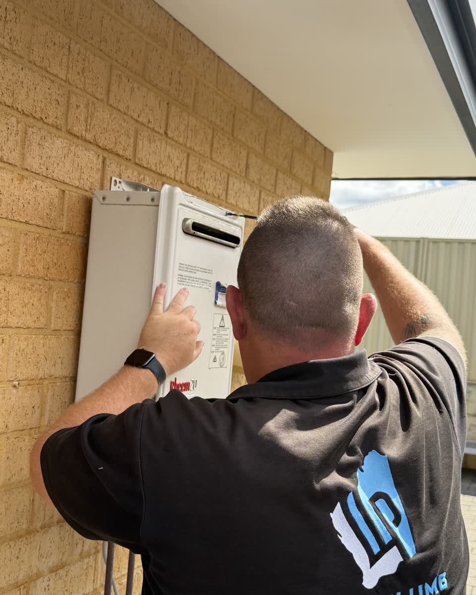 Brent working on a continuous flow hot water unit
